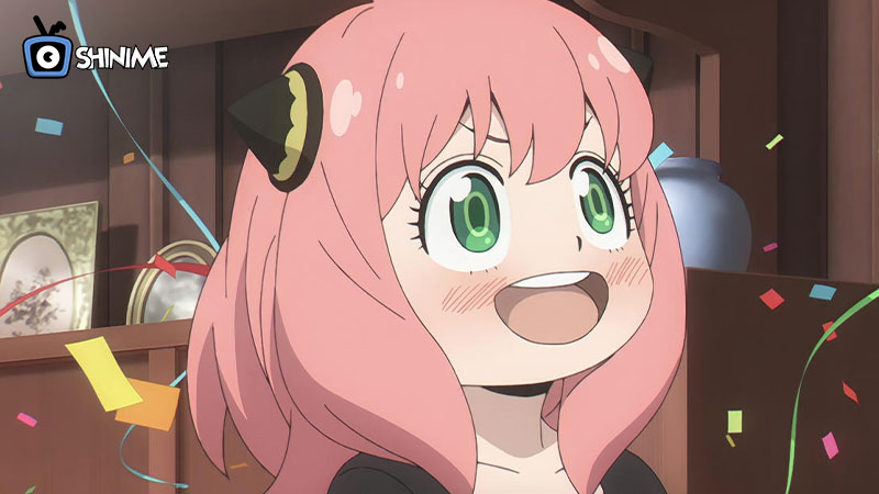 Anya con expresión emocionada y confeti, ícono adorable del top 10 most popular anime characters 2024