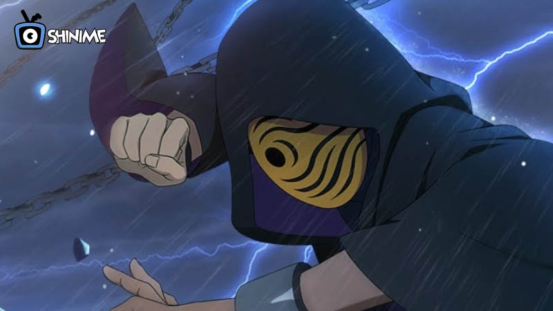 Obito Uchiha in hooded cloak with chains and storm, masked menace in top 10 most powerful anime characters in Naruto