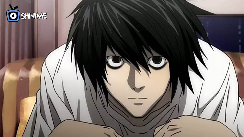 L from Death Note crouched and thinking, a prime example of smart anime characters in detective roles