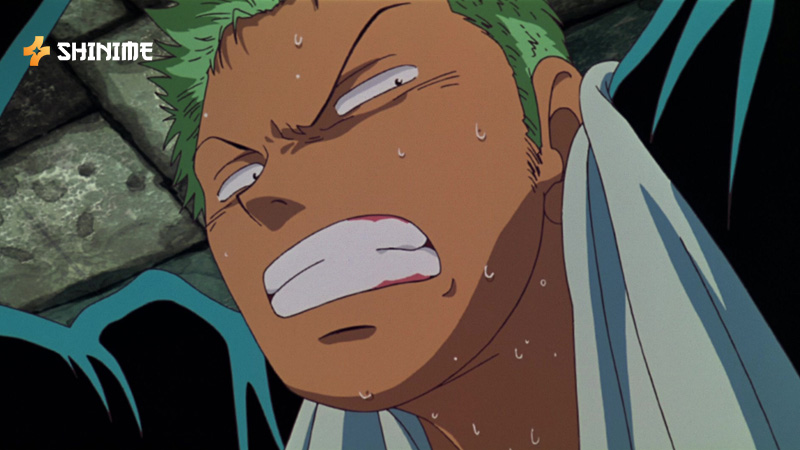 Zoro slashing with three swords in a fast-paced fight scene from One Piece Movie 2