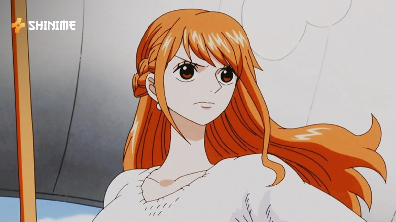 Nami looking wary while planning on Asuka Island in One Piece Movie 5: The Cursed Holy Sword
