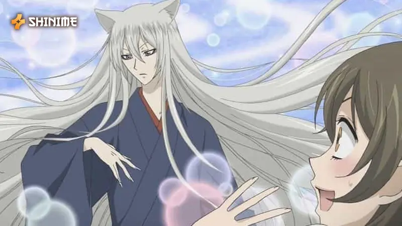 Nanami Momozono in Kamisama Kiss, a shoujo anime show, with fox spirit Tomoe in a magical, folklore-inspired setting.