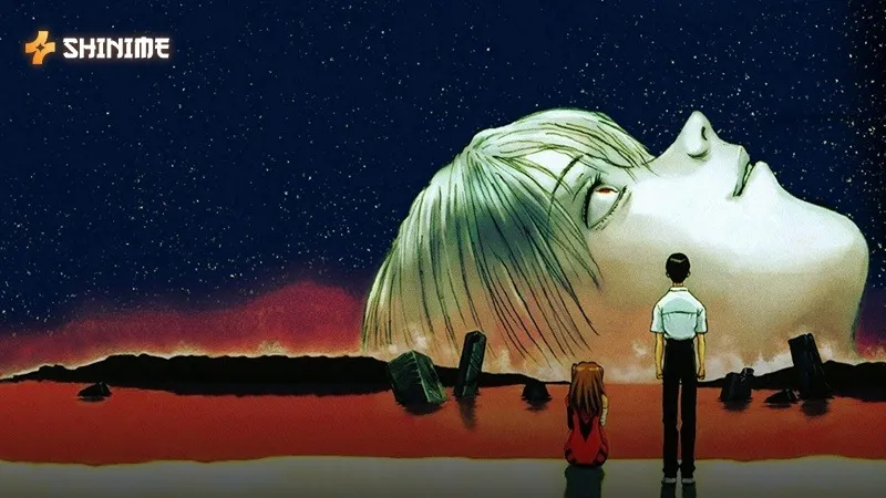Shinji and Asuka on a desolate shore before the giant head of Rei in the red sea of the mecha anime Evangelion.